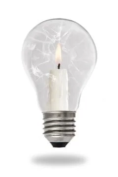 Candle lit steaming inside a broken light bulb Stock Photos