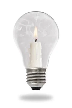Candle lit steaming inside a light bulb Stock Photos