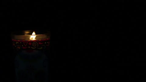 A candle lit in total darkness Video stock 139659460