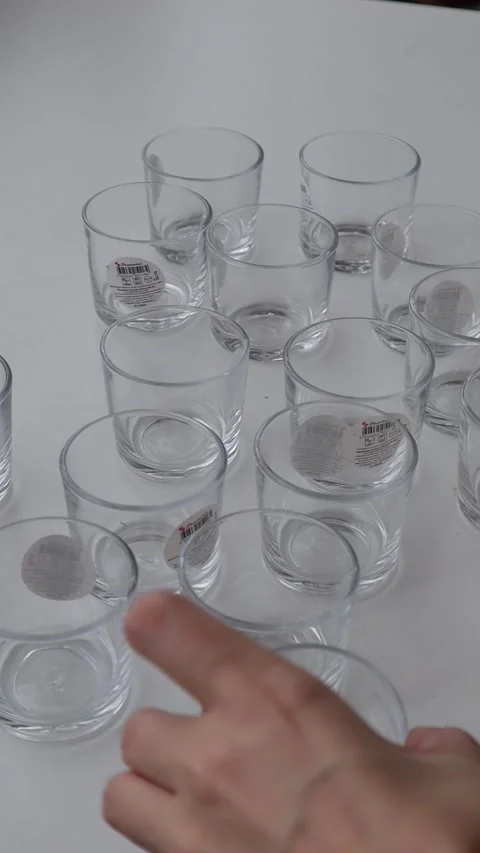 The candle-making process in glasses, from pouring wax to setting the wick. 스톡 동영상 313483130