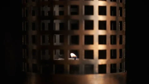Candle in a metal holder	 Stock Footage 146068596