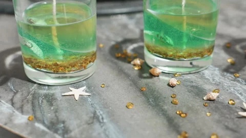 Candle Mold with Wax Layers on Chef Table Decorated with Golden Elements Stock Footage 307991783