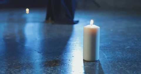 Candle in the monastery stands on the floor. close-up Stock Footage 91473457