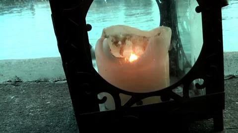 Candle Next to River Stock Footage 8687040