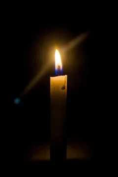 A candle in the night Stock Photos