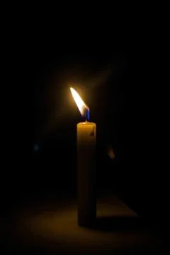 A candle in the night Stock Photos