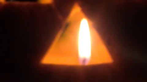 Candle is in the nose of the pumpkin Stock Footage 85843156