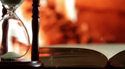 Candle in an open book. Video stock 9824026