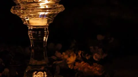 Candle over flower wreath Stock Footage 8906553
