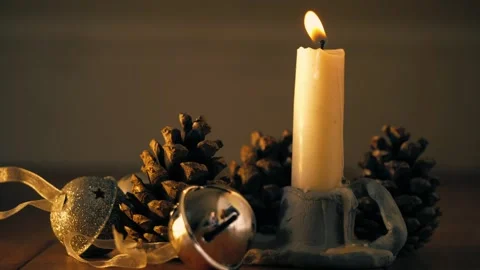 Candle with pine cone and bells Stock Footage 310201958