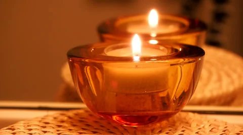 Candle in red glass container Stock Footage 35486999