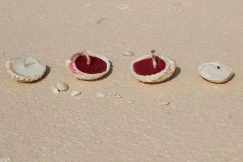 Candle in sand Foto stock