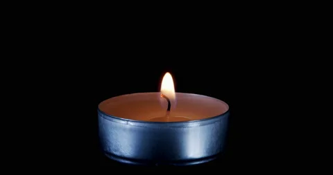 Candle. Seamlessly loop footage with copy space. Burning candle isolated on a Stock Footage 161879285