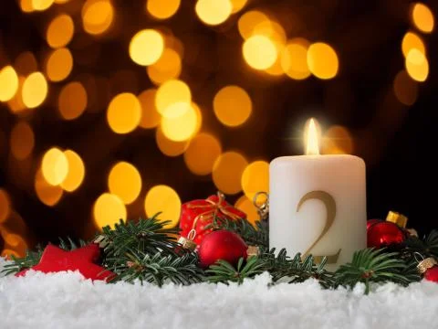 Candle of the second Advent burns Stock Photos