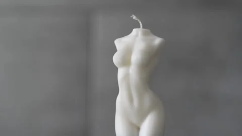 A candle in the shape of a woman's torso. Video stock 267073109