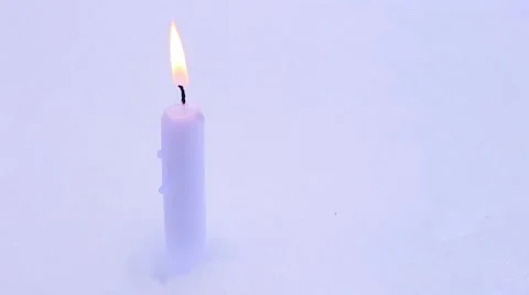 Candle on snow Stock Footage 60854879