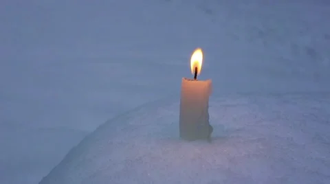 Candle on snow Stock Footage 60910703