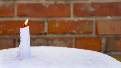 Candle on snow Stock Footage 66439416