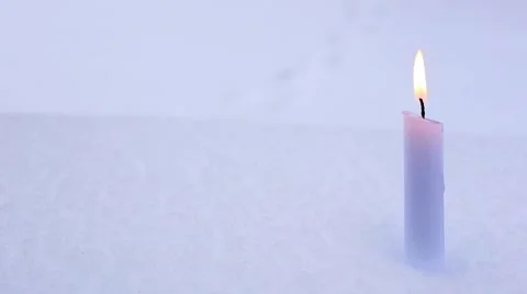 Candle on snow Stock Footage 66439428