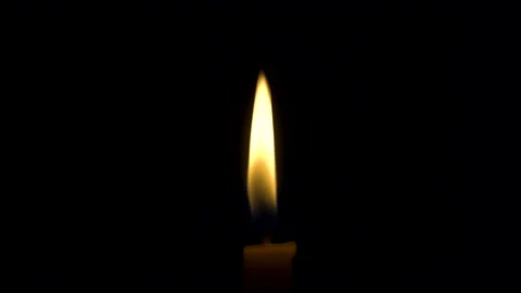 Candle in space on black background Stock Footage 132571140