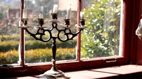 Candle stick sitting in window Stock-Footage 1138852