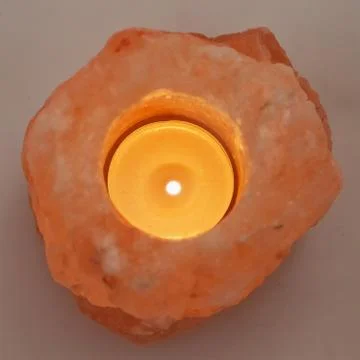 Candle in stone Stock Photos