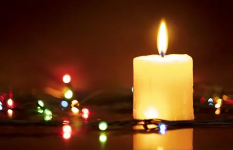 Candle on table with bokeh background Stock Photos