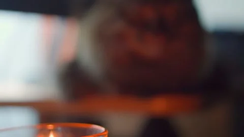 Candle on the table. Close-up. Slow motion Vídeo Stock 169504234