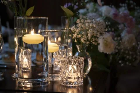 A candle on the table is on fire Stock-Fotos