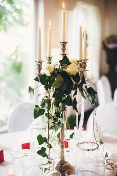 Candle on the table at the wedding party Stock Photos