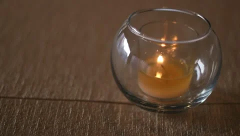 Candle on tan tablecloth Stock-Footage 11043761