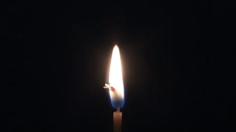 Candle. A thin candle burned in the dark Video stock 77955691
