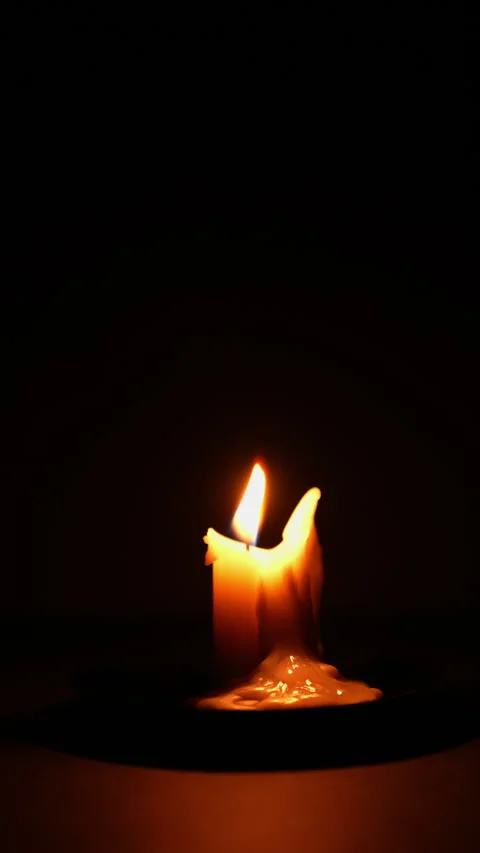 Candle timelapse in darkness vertical. Single burning candle in dark room t.. Stock Footage 344625533