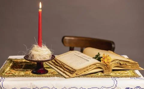 A candle on a vintage table Foto stock