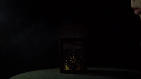 The candle went out in a lantern with on a black background, close-up. Stock Footage 81418309