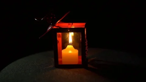 The candle went out in a lantern with on a black background, close-up. Stock Footage 82626637
