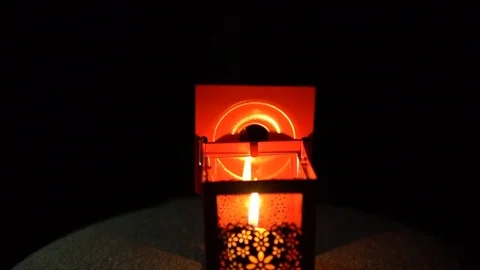 The candle went out in a lantern with on a black background, close-up. Stock Footage 82627160
