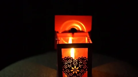 The candle went out in a lantern with on a black background, close-up. Stock Footage 82627235