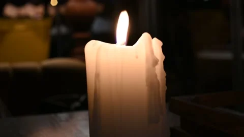 Candle White Big Burning in the Wind Close-up Video 4k Stock Footage 136039987