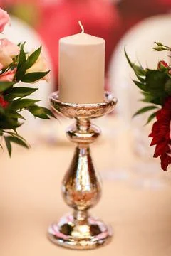 Candle on the white table Stock Photos