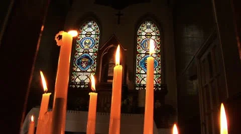 Candle at window of gothic church Stock Footage