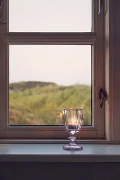 Candle in a window Stock Photos