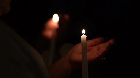 Candle in women's hands close-up Stock Footage 139621257