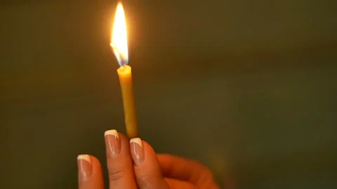 Candle in women's hands Stock Footage 97407028