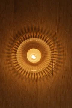 Candlelight Casting Shadows on Wood Stock Photos