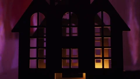 Candlelight dances in a dark castle, creating haunting shadows through windows. Stock Footage 319746899