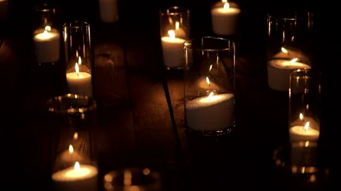 Candlelight on a dark festive background Stock Footage 235889280