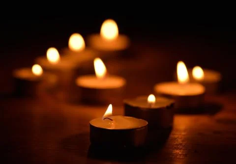 Candlelight in the dark Stock Photos