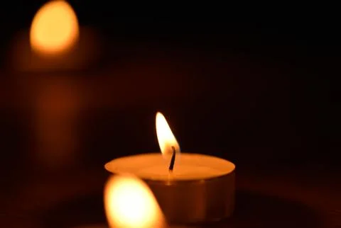 Candlelight in the dark Stock Photos