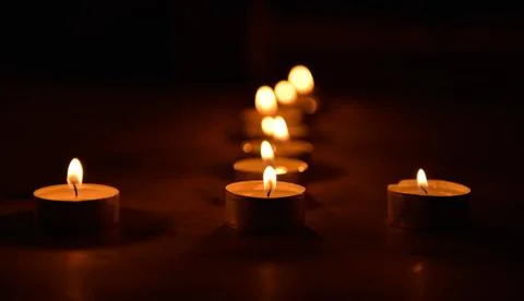 Candlelight in the dark Stock Photos